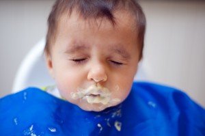 Baby boy's first taste of yogurt