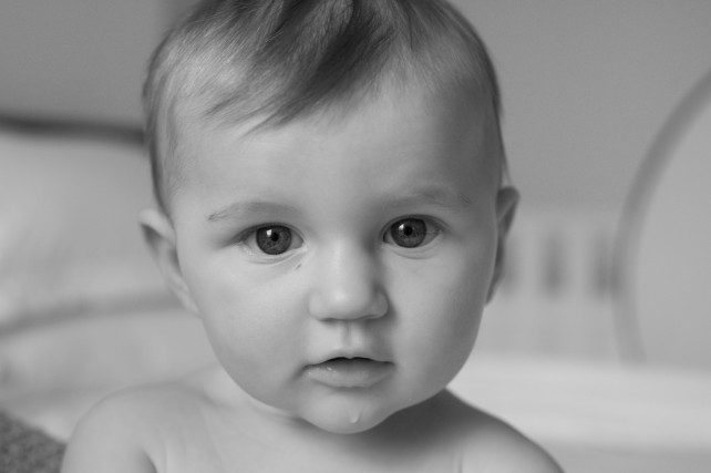 Black and white portrait of six month old baby girl